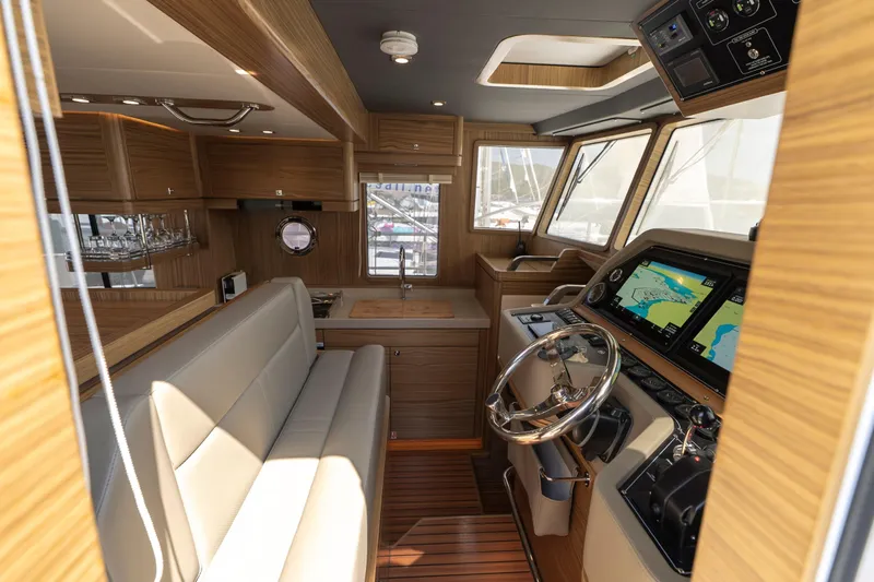  Yacht Photos Pics Luxurious interior of 2024 Nordhavn 41 yacht with modern navigation and seating.