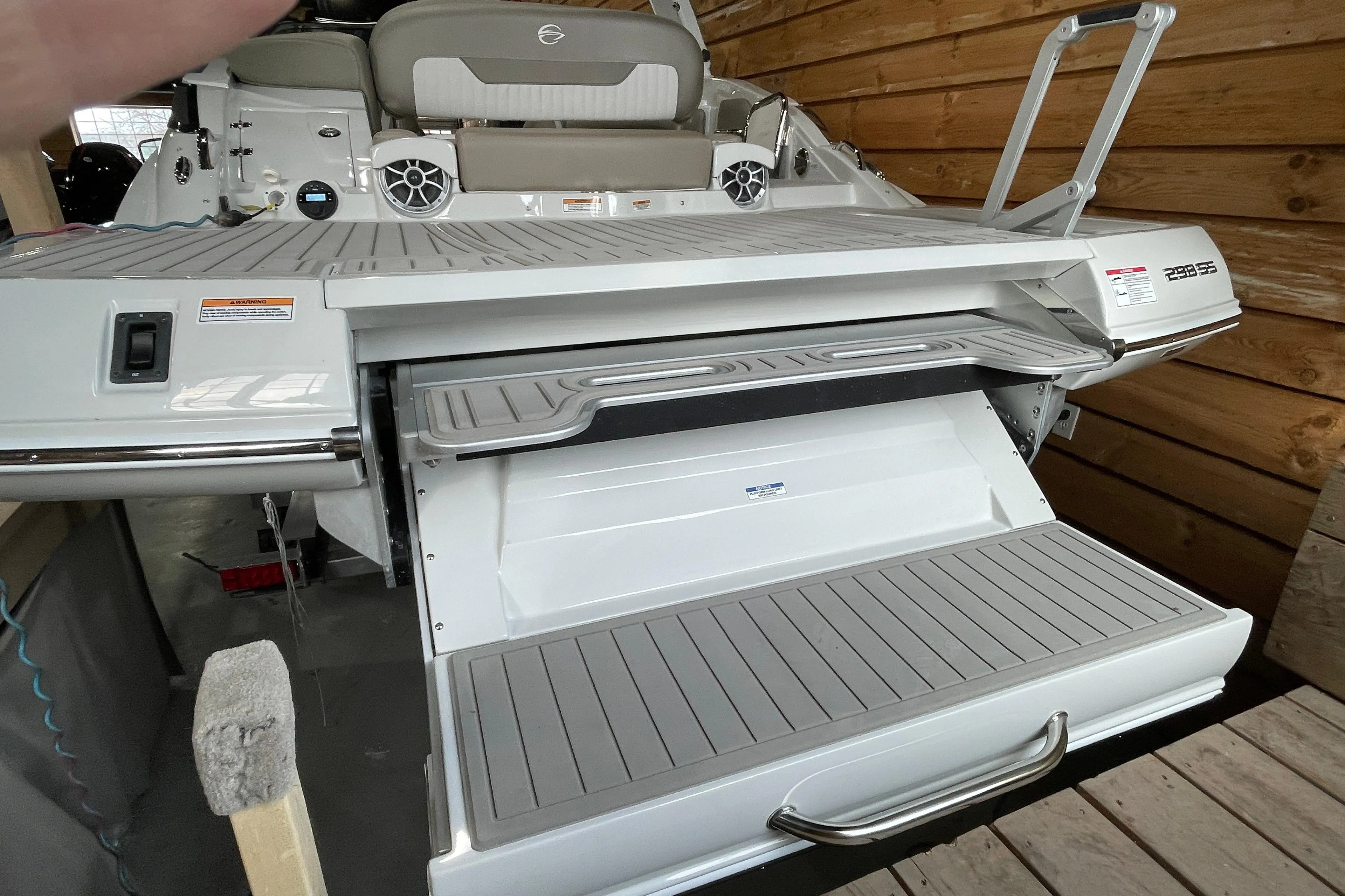 2026 Crownline 298 SS boat with extended swim platform and seating area.