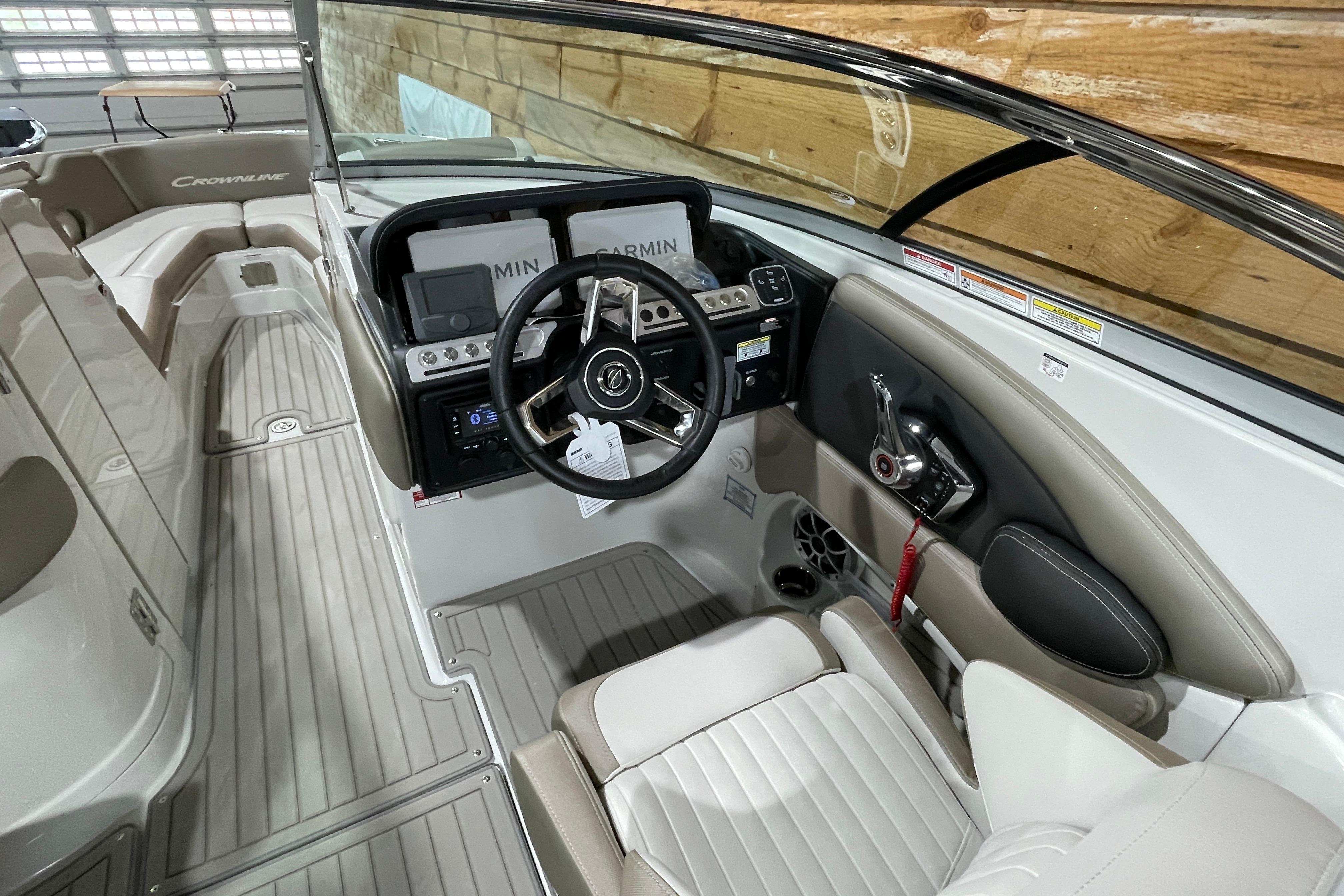 2026 Crownline 298 SS boat interior with modern dashboard and steering wheel.