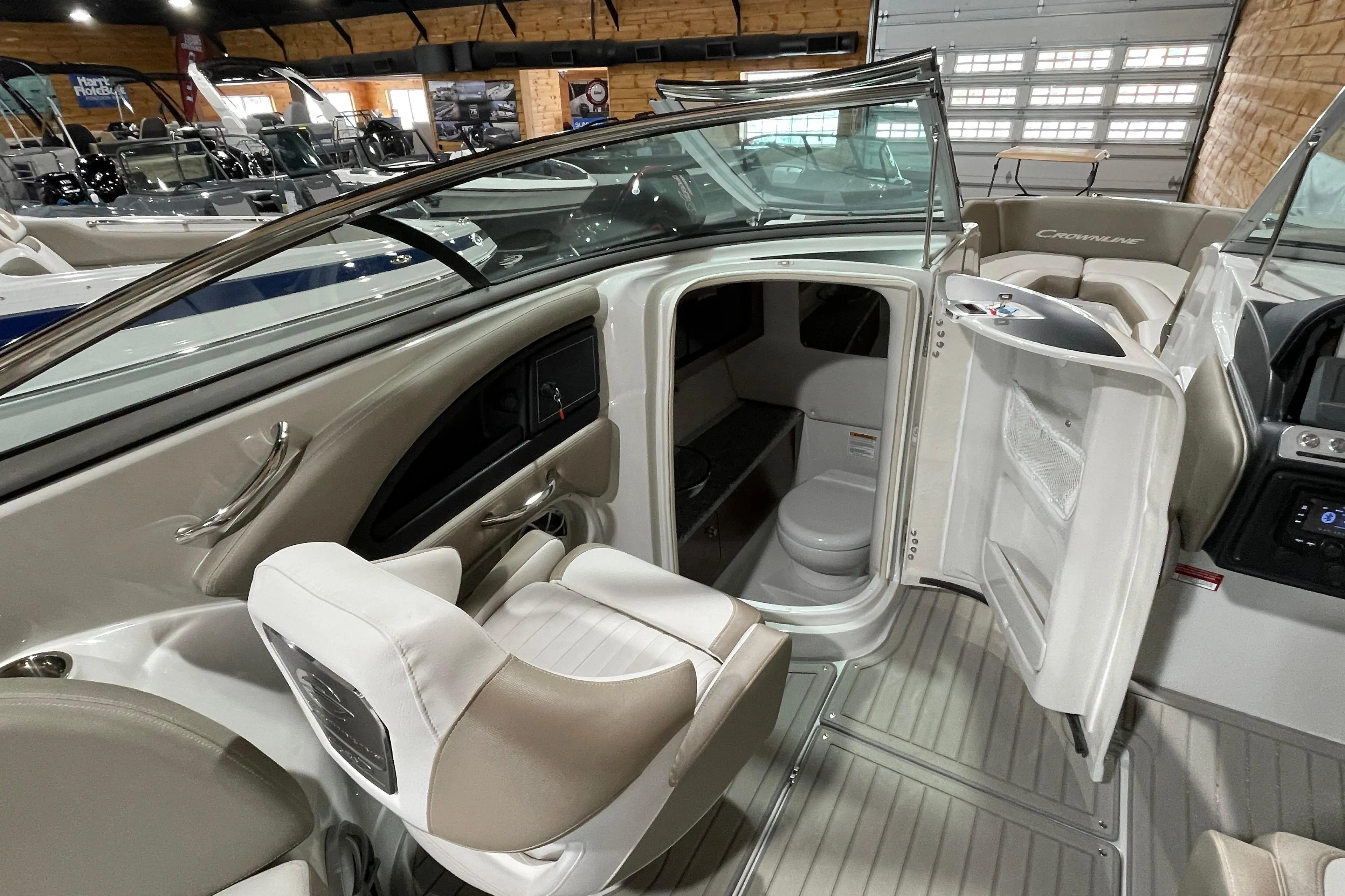 2026 Crownline 298 SS boat interior with seating and cabin view.