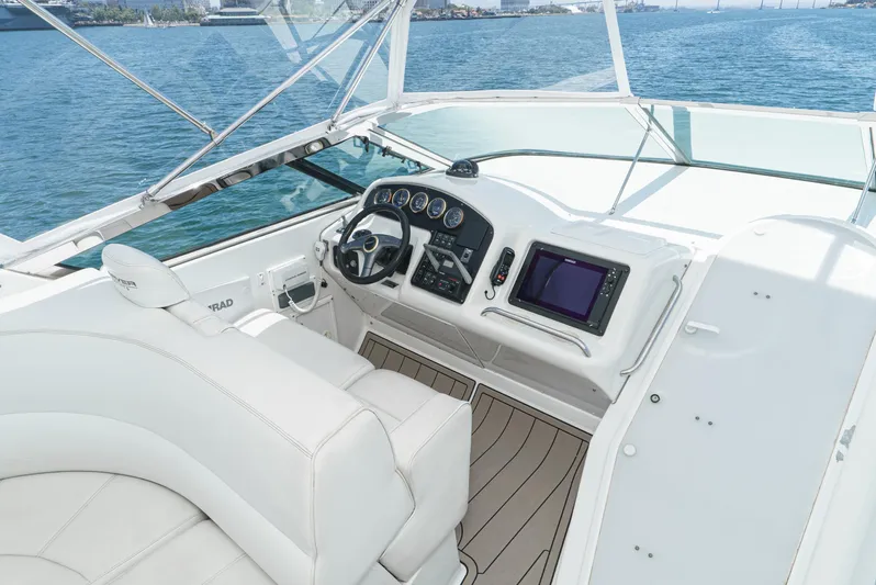 All Falked Up Yacht Photos Pics 1999 Carver 530 Voyager Pilothouse helm with modern controls and panoramic water view.