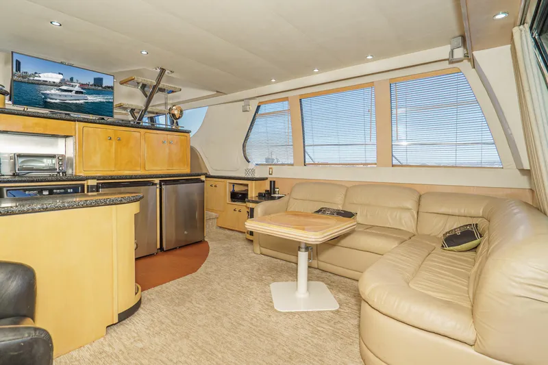 All Falked Up Yacht Photos Pics Luxurious interior of 1999 Carver 530 Voyager Pilothouse with leather seating and modern amenities.