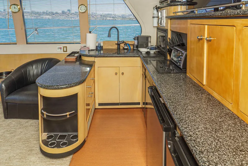 All Falked Up Yacht Photos Pics Luxurious kitchen interior of 1999 Carver 530 Voyager Pilothouse yacht with ocean view.