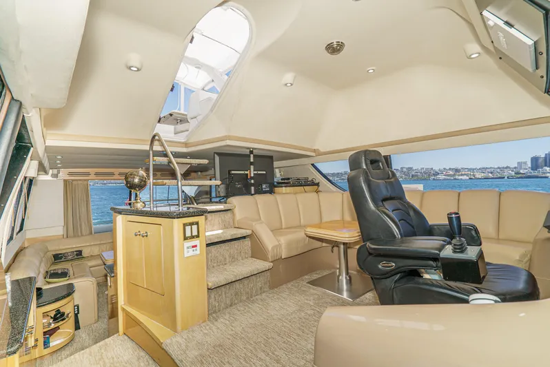 All Falked Up Yacht Photos Pics Luxurious interior of 1999 Carver 530 Voyager Pilothouse yacht with leather seating and panoramic views.