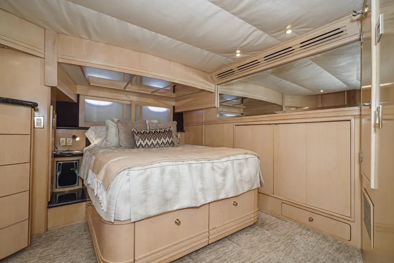 All Falked Up Yacht Photos Pics Luxurious bedroom interior of 1999 Carver 530 Voyager Pilothouse yacht with elegant wood finish.
