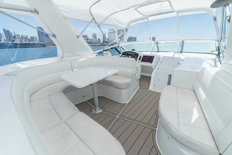 All Falked Up Yacht Photos Pics Luxurious 1999 Carver 530 Voyager Pilothouse interior with city skyline view.