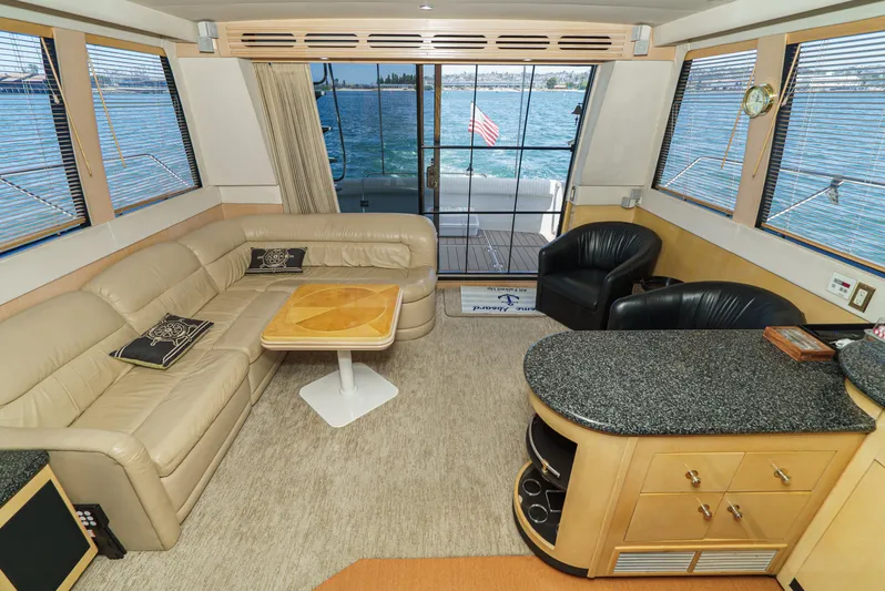 All Falked Up Yacht Photos Pics Luxurious interior of 1999 Carver 530 Voyager Pilothouse with leather seating and ocean view.