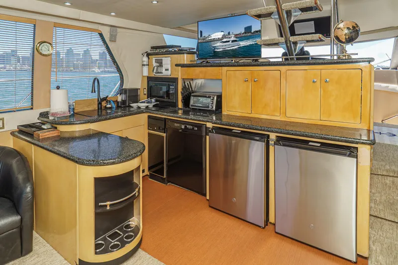 All Falked Up Yacht Photos Pics Luxurious kitchen interior of 1999 Carver 530 Voyager Pilothouse yacht with modern appliances.