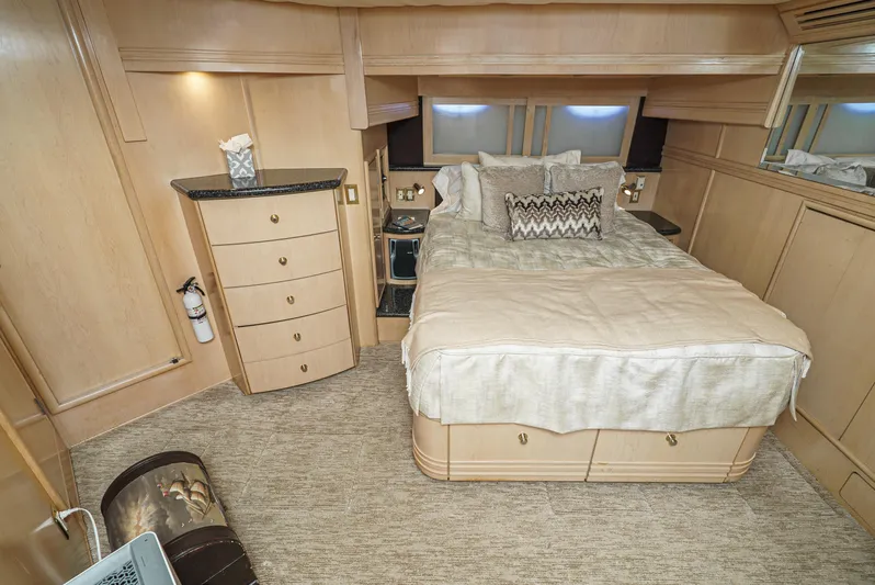 All Falked Up Yacht Photos Pics Luxurious bedroom in 1999 Carver 530 Voyager Pilothouse yacht with elegant decor and cozy bedding.
