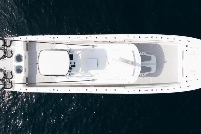 Seeking Twin Tales Yacht Photos Pics Overhead view of 2022 Invincible 46 Catamaran on open water.