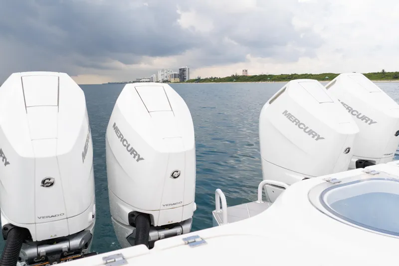 Seeking Twin Tales Yacht Photos Pics Four Mercury outboard engines on a 2022 Invincible 46 Catamaran, ocean view.