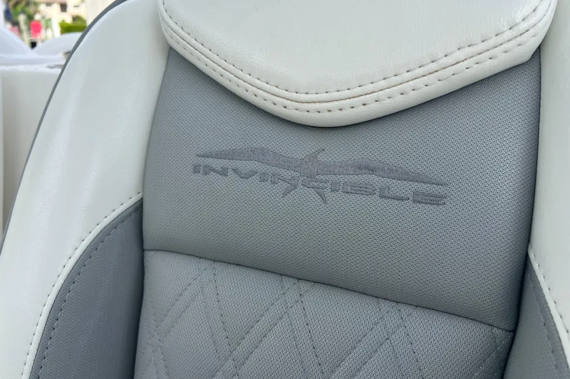 Seeking Twin Tales Yacht Photos Pics Close-up of Invincible 46 Catamaran 2022 seat with logo embroidery.