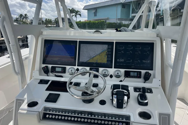 Seeking Twin Tales Yacht Photos Pics Helm of 2022 Invincible 46 Catamaran with advanced navigation and control systems.
