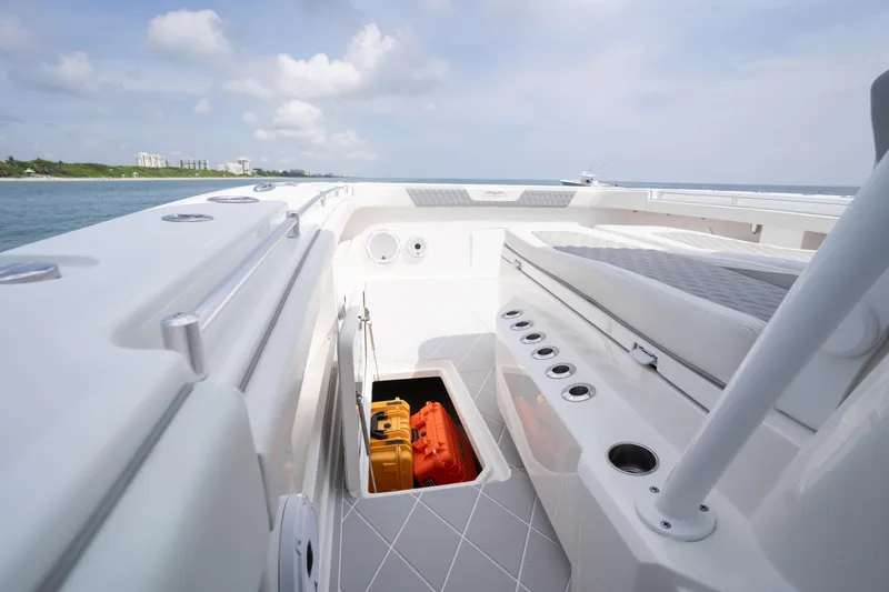 Seeking Twin Tales Yacht Photos Pics Invincible 46 Catamaran 2022 deck view with storage compartment and seating.