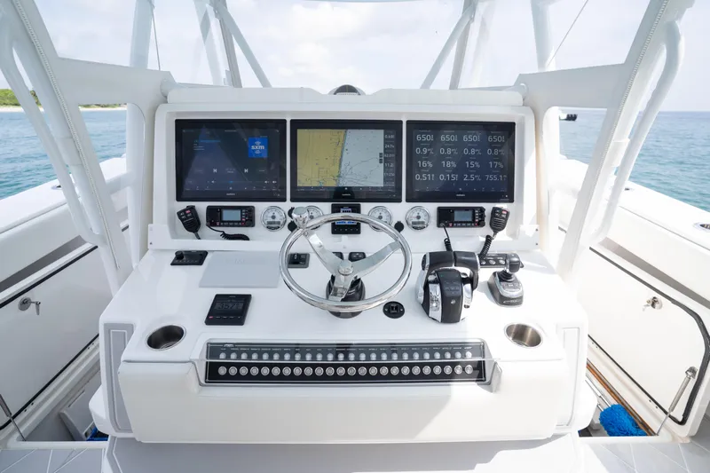 Seeking Twin Tales Yacht Photos Pics Control panel of 2022 Invincible 46 Catamaran with advanced navigation and communication systems.