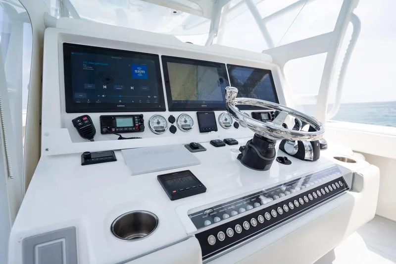 Seeking Twin Tales Yacht Photos Pics Helm of 2022 Invincible 46 Catamaran with advanced navigation and control systems.