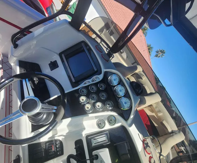  Yacht Photos Pics 2012 Deep Impact 36 Cuddy Cabin dashboard with steering wheel and gauges.