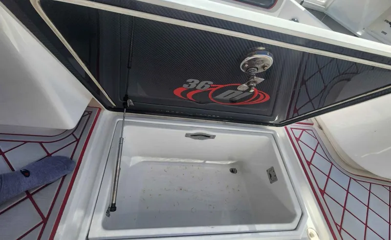  Yacht Photos Pics Open storage compartment on a 2012 Deep Impact 36 Cuddy Cabin boat.