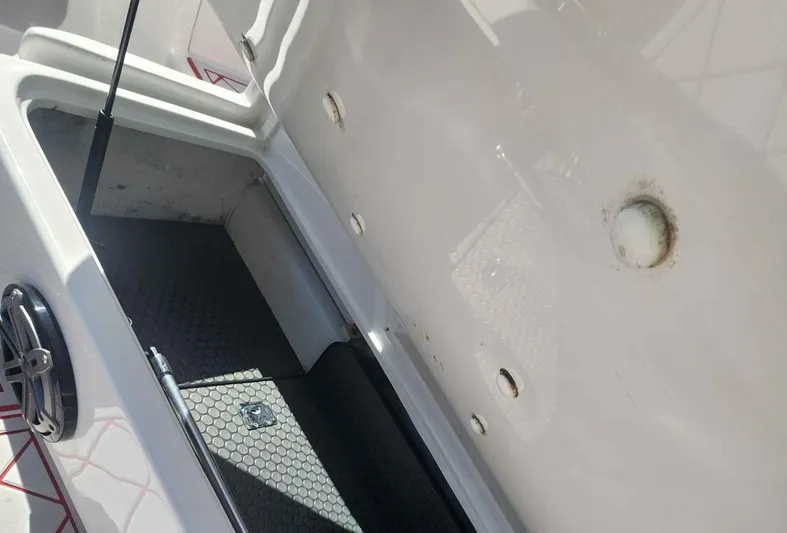  Yacht Photos Pics 2012 Deep Impact 36 Cuddy Cabin interior storage compartment with clean, white finish.