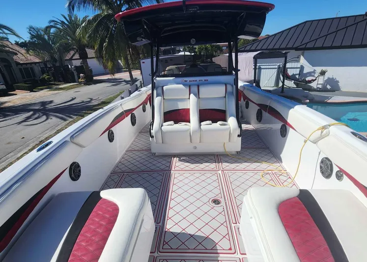  Yacht Photos Pics 2012 Deep Impact 36 Cuddy Cabin boat with spacious seating and stylish interior design.