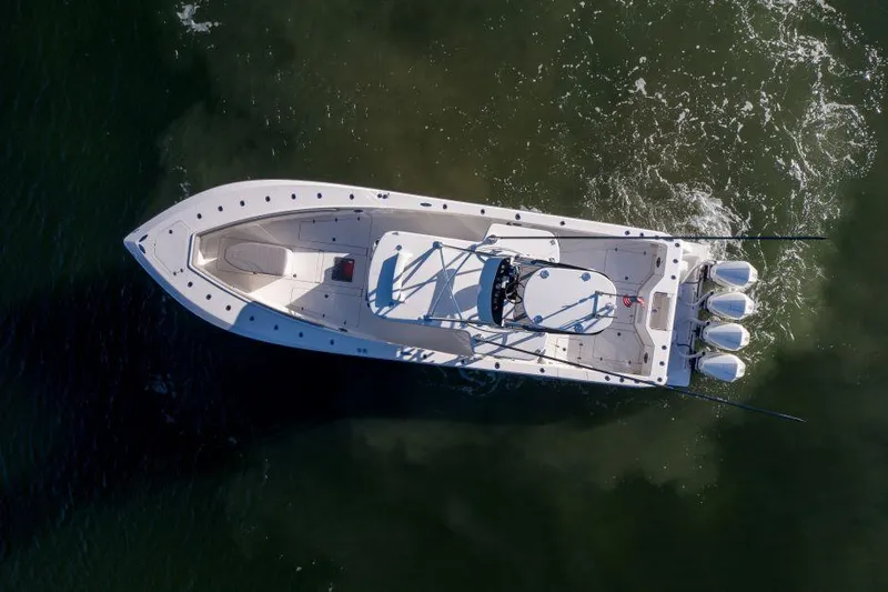  Yacht Photos Pics Aerial view of 2022 SeaVee 390Z boat with triple engines on water.