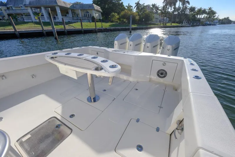  Yacht Photos Pics 2022 SeaVee 390Z boat with quad engines, docked by a waterfront property.