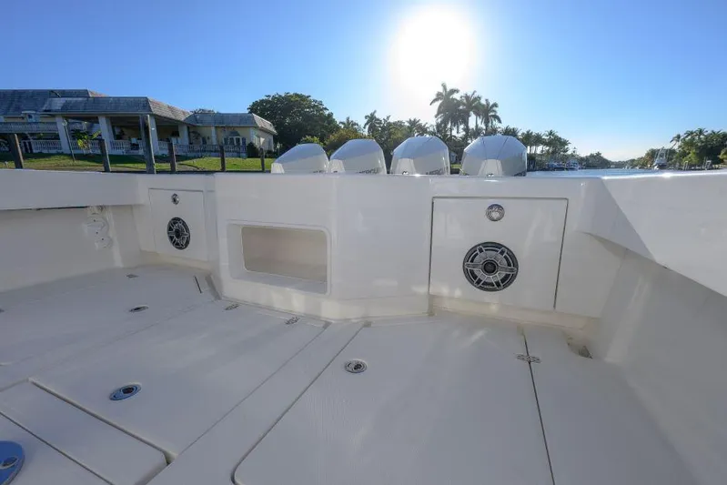  Yacht Photos Pics 2022 SeaVee 390Z boat deck with speakers, under a clear blue sky.