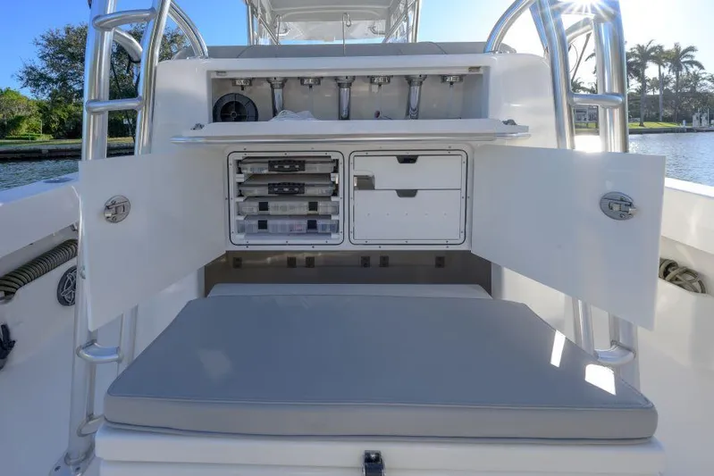  Yacht Photos Pics 2022 SeaVee 390Z boat with open storage compartments and seating area.