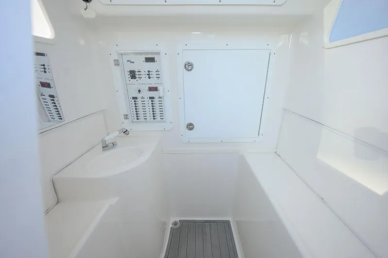  Yacht Photos Pics 2022 SeaVee 390Z interior with control panels and storage compartment.