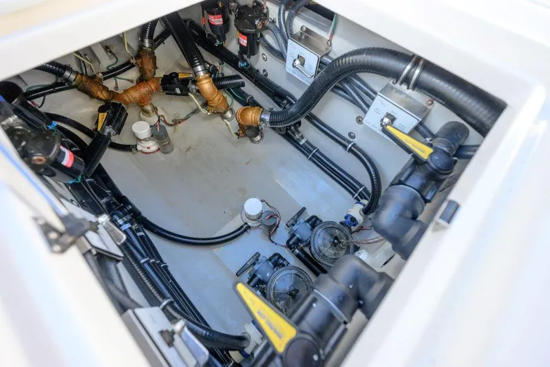 Yacht Photos Pics 2022 SeaVee 390Z boat engine compartment with visible wiring and components.