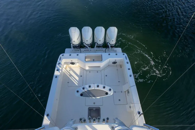  Yacht Photos Pics 2022 SeaVee 390Z boat with four outboard engines on calm water.