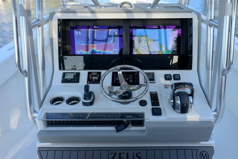  Yacht Photos Pics 2022 SeaVee 390Z helm with dual navigation screens and modern controls.