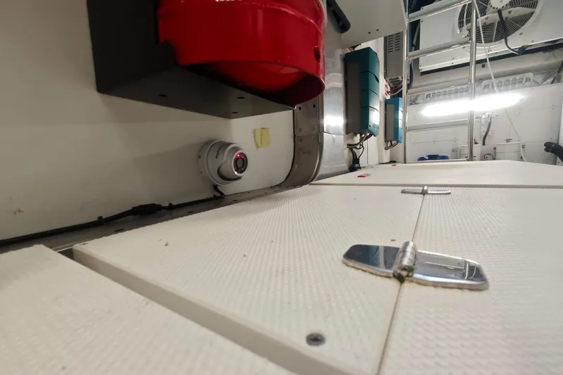 Arktur Yacht Photos Pics Engine room of 2023 Cranchi Sessantasette 67 yacht with equipment and safety features.