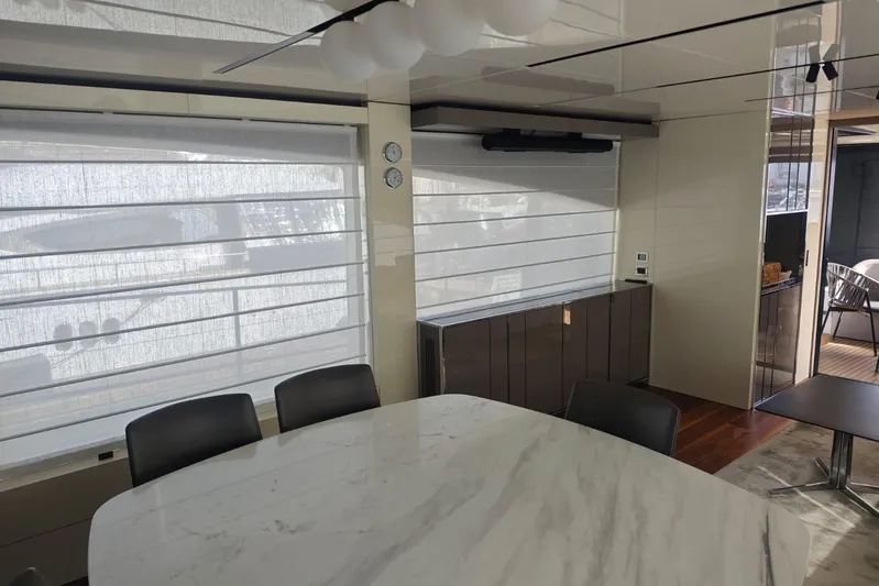 Arktur Yacht Photos Pics Luxurious interior of 2023 Cranchi Sessantasette 67 yacht with modern dining area.