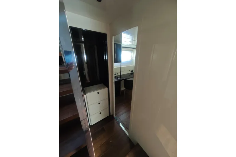 Arktur Yacht Photos Pics Interior view of 2023 Cranchi Sessantasette 67 yacht, featuring modern design and wooden flooring.