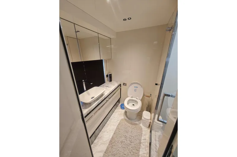 Arktur Yacht Photos Pics Luxurious bathroom in 2023 Cranchi Sessantasette 67 yacht, featuring modern fixtures and elegant design.