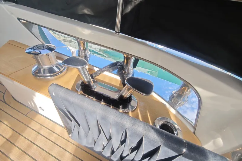 Arktur Yacht Photos Pics 2023 Cranchi Sessantasette 67 yacht deck with polished metal fittings and wooden flooring.