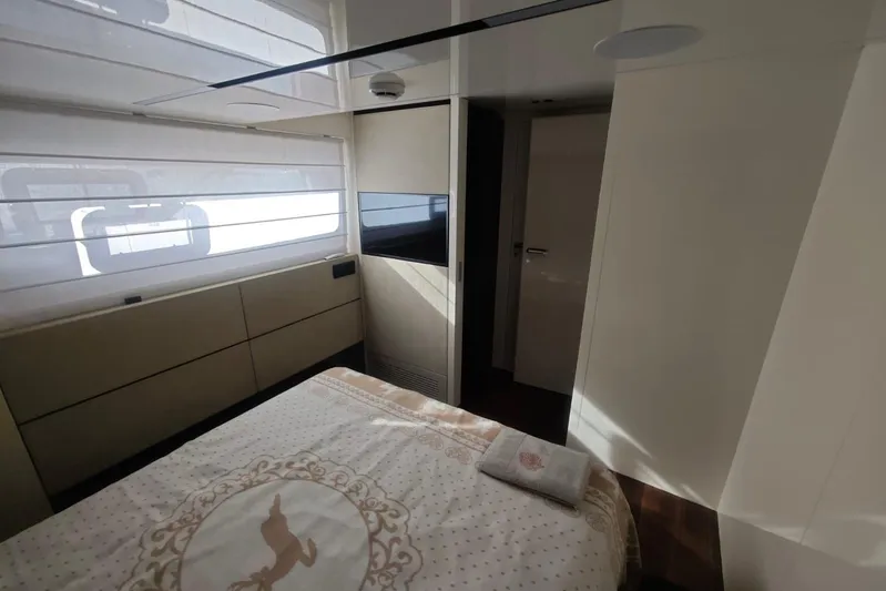 Arktur Yacht Photos Pics Luxurious bedroom interior of 2023 Cranchi Sessantasette 67 yacht, featuring elegant design and natural light.