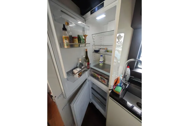 Arktur Yacht Photos Pics Modern kitchen with open fridge in 2023 Cranchi Sessantasette 67 yacht.