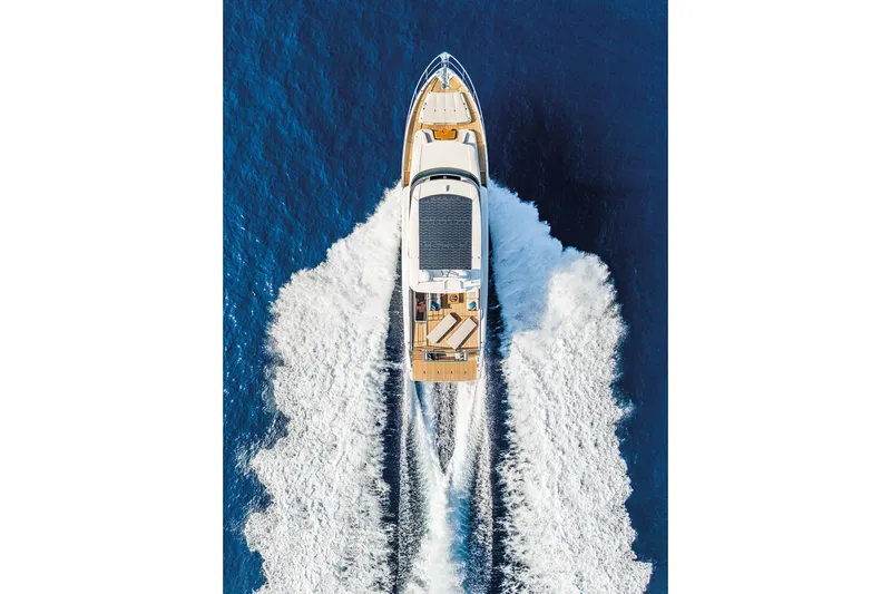  Yacht Photos Pics Aerial view of 2026 Absolute NAVETTA 70 yacht cruising on blue ocean waters.