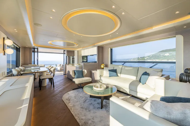  Yacht Photos Pics Luxurious interior of 2026 Absolute NAVETTA 70 yacht with elegant seating and ocean views.