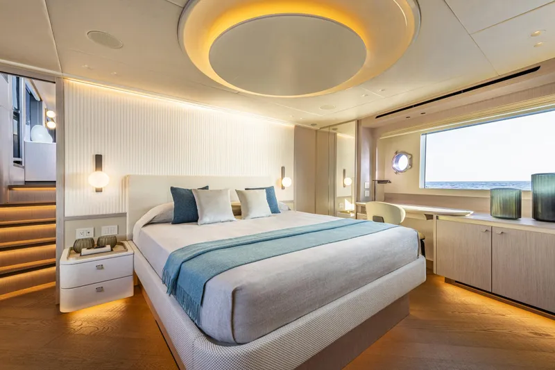  Yacht Photos Pics Luxurious bedroom interior on 2026 Absolute NAVETTA 70 yacht, featuring modern design and ocean view.