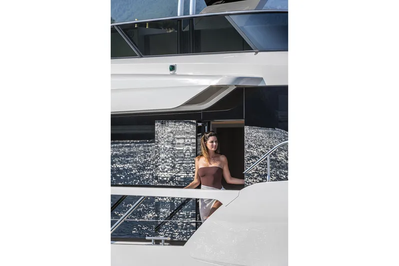  Yacht Photos Pics Woman enjoying the view on Absolute NAVETTA 70 yacht, 2026 model.