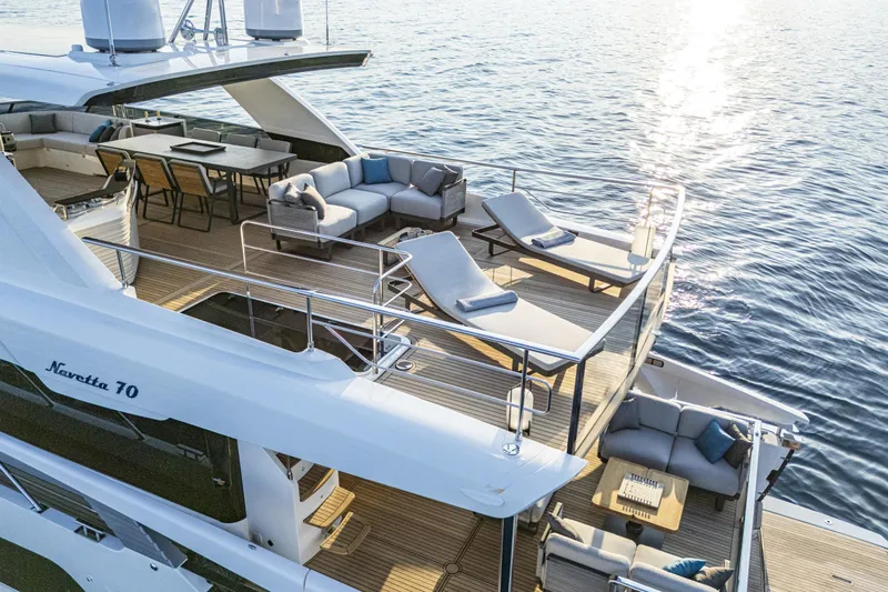  Yacht Photos Pics Luxurious 2026 Absolute NAVETTA 70 yacht with spacious deck and elegant seating.