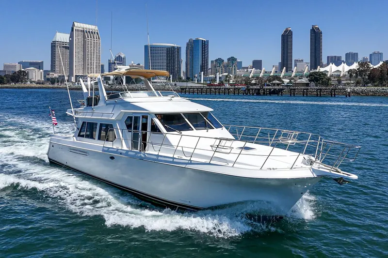 Freedom Rocks Yacht Photos Pics Navigator Rival 57 yacht cruising near city skyline, 2004 model.