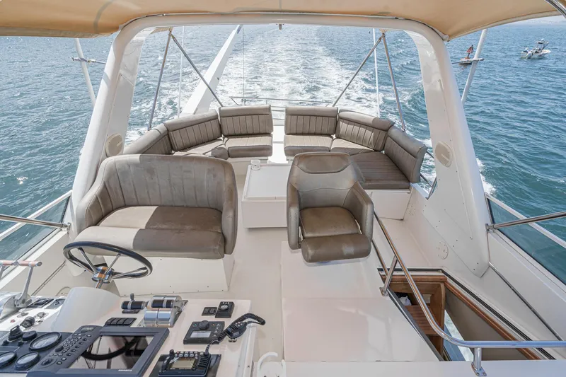 Freedom Rocks Yacht Photos Pics Luxurious 2004 Navigator Rival 57 yacht interior with plush seating and ocean view.