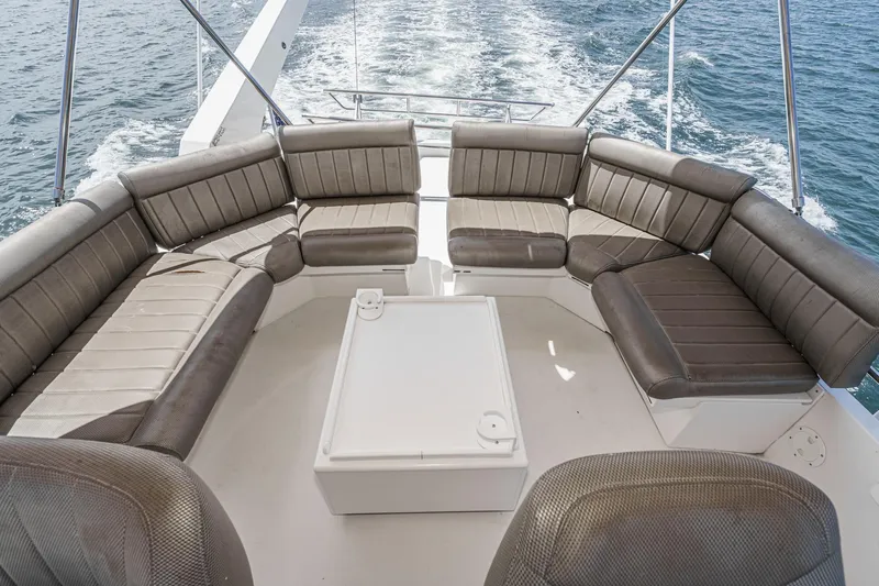 Freedom Rocks Yacht Photos Pics Luxurious seating area on 2004 Navigator Rival 57 yacht, cruising on open water.