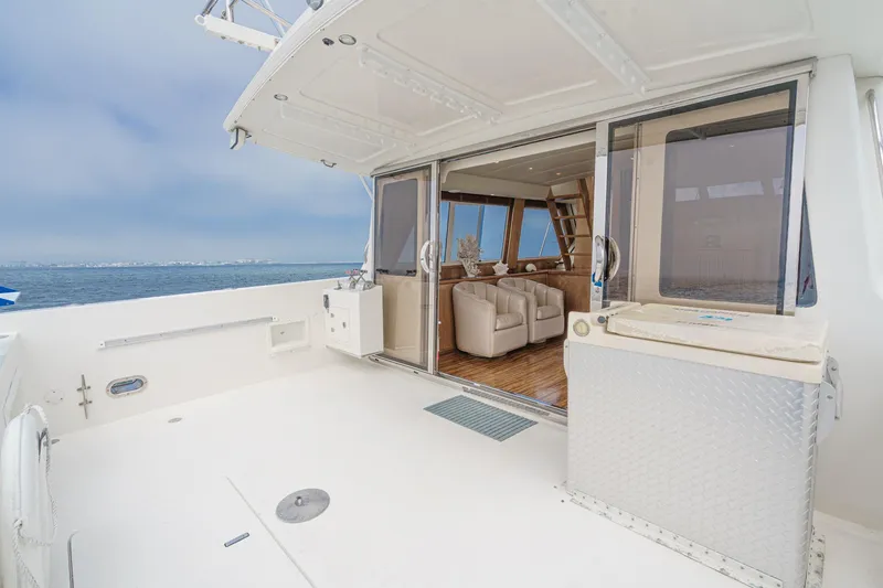 Freedom Rocks Yacht Photos Pics 2004 Navigator Rival 57 yacht with spacious deck and luxurious interior.