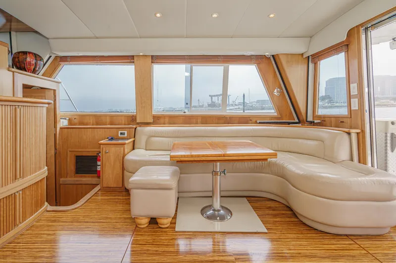 Freedom Rocks Yacht Photos Pics Luxurious interior of 2004 Navigator Rival 57 yacht with leather seating and wooden accents.