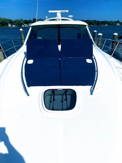 Down Time Yacht Photos Pics 2010 Sea Ray 500 Sundancer yacht with blue sun loungers on deck.